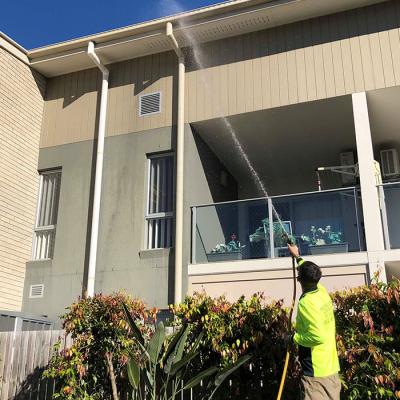 Steve using low pressure machine to wash a Brisbane brick home