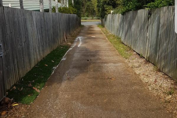 Dirty backyard pathway before photo