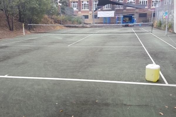 Dirty tennis court before photo