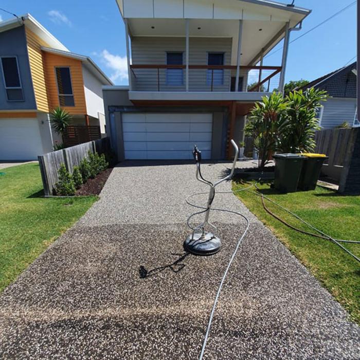 High pressure cleaning machine on driveway
