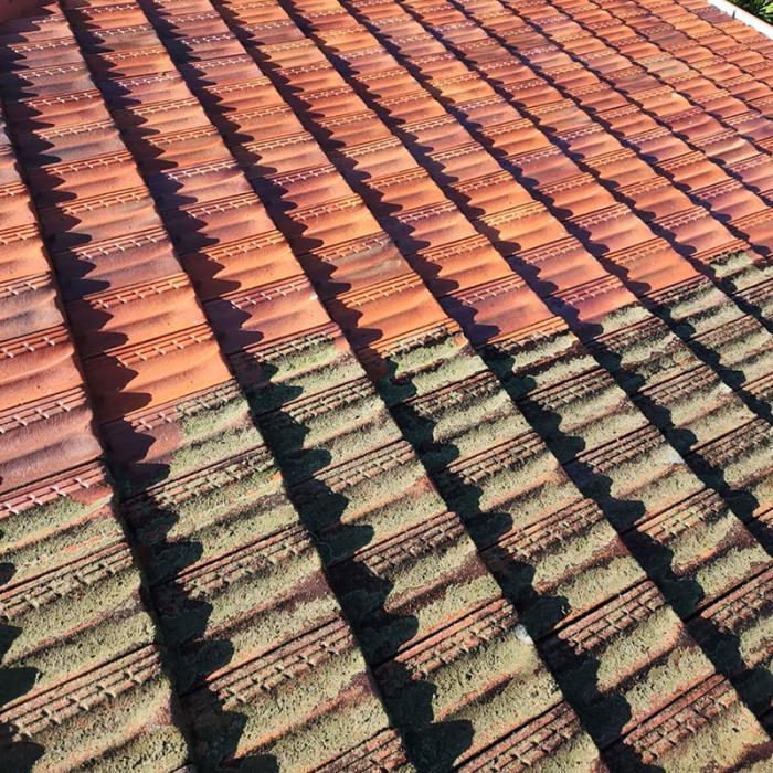 Dirty roof half cleaned with pressure cleaner - big difference!
